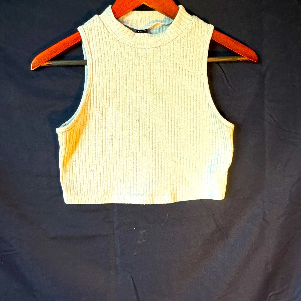 Light blue cropped tank with a higher neck